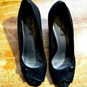 Coach and four black pumps